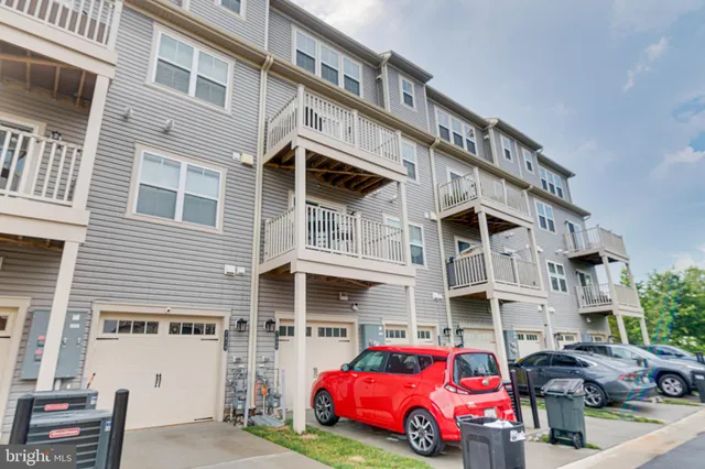 a front view of residential houses with street