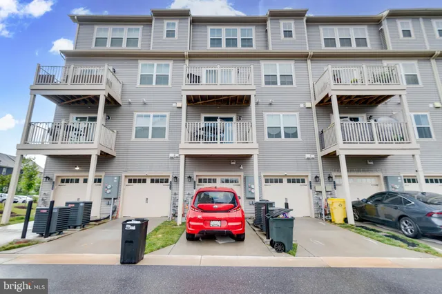 a room with a table chairs and a flat screen tv