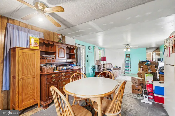 a very nice looking dining room with furniture