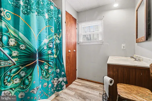 a bathroom with a sink and mirror