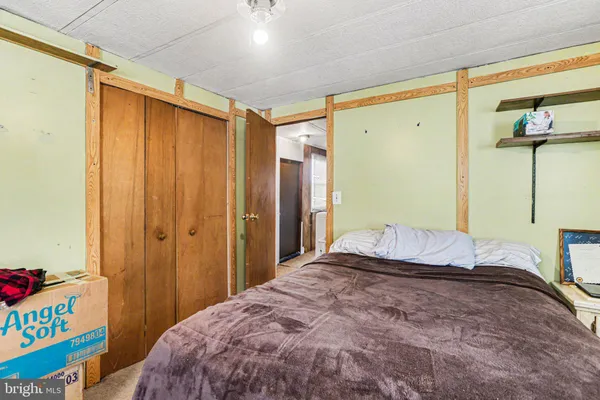 a bedroom with a bed and a table