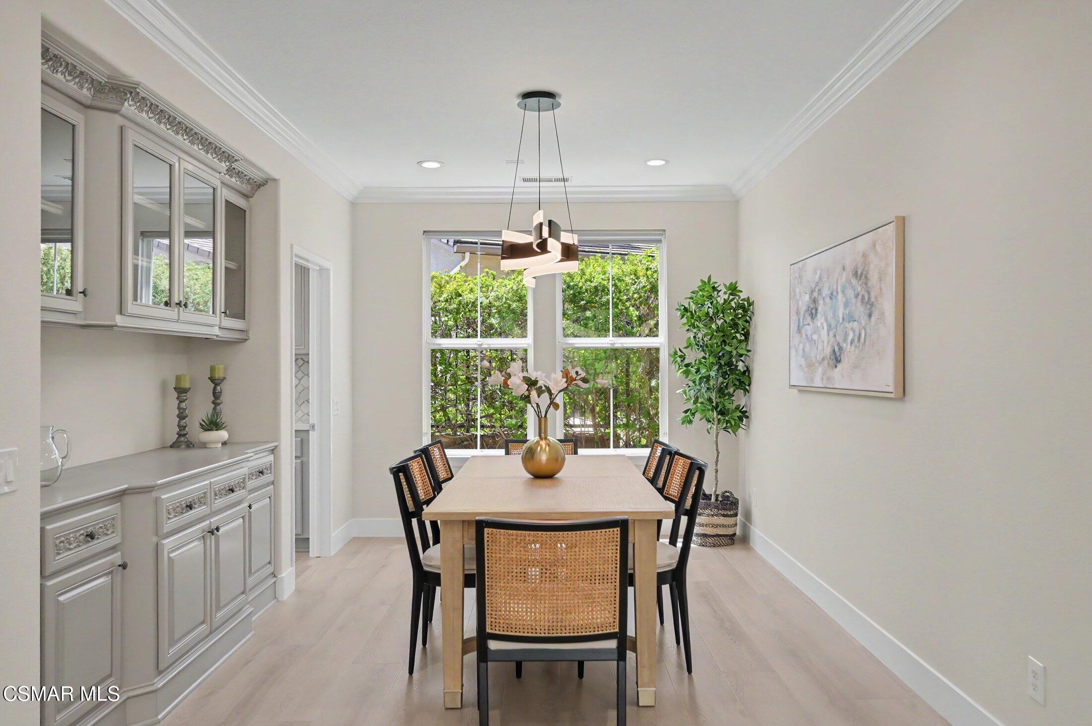 20800 Sardinia Way Porter Ranch, CA 91326 - Photo 7 of 57 a dining room with furniture and window