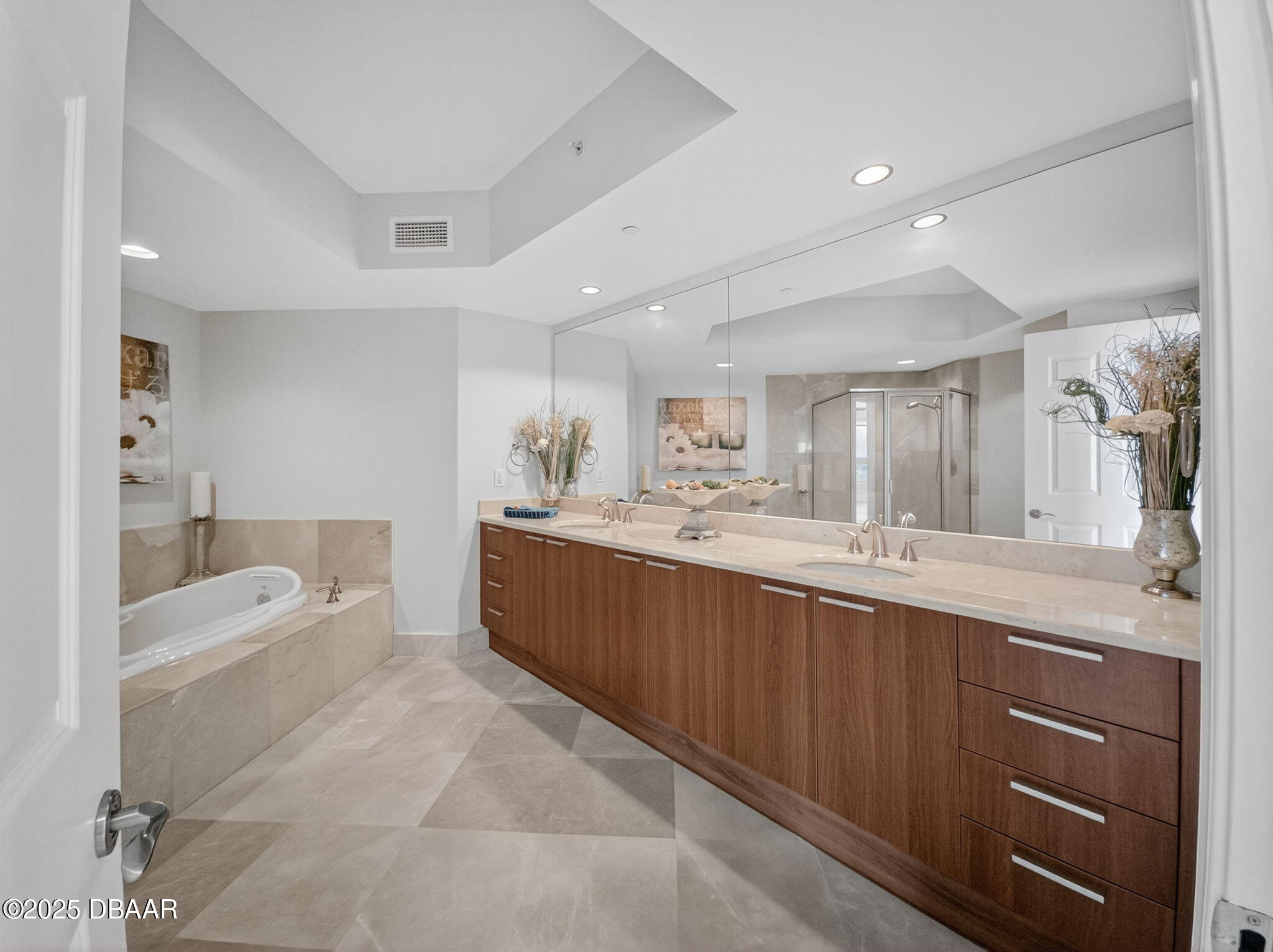 231 Riverside Drive, Unit 2409 Holly Hill, FL 32117 - Photo 18 of 24 a spacious bathroom with a granite countertop tub sink shower and mirror