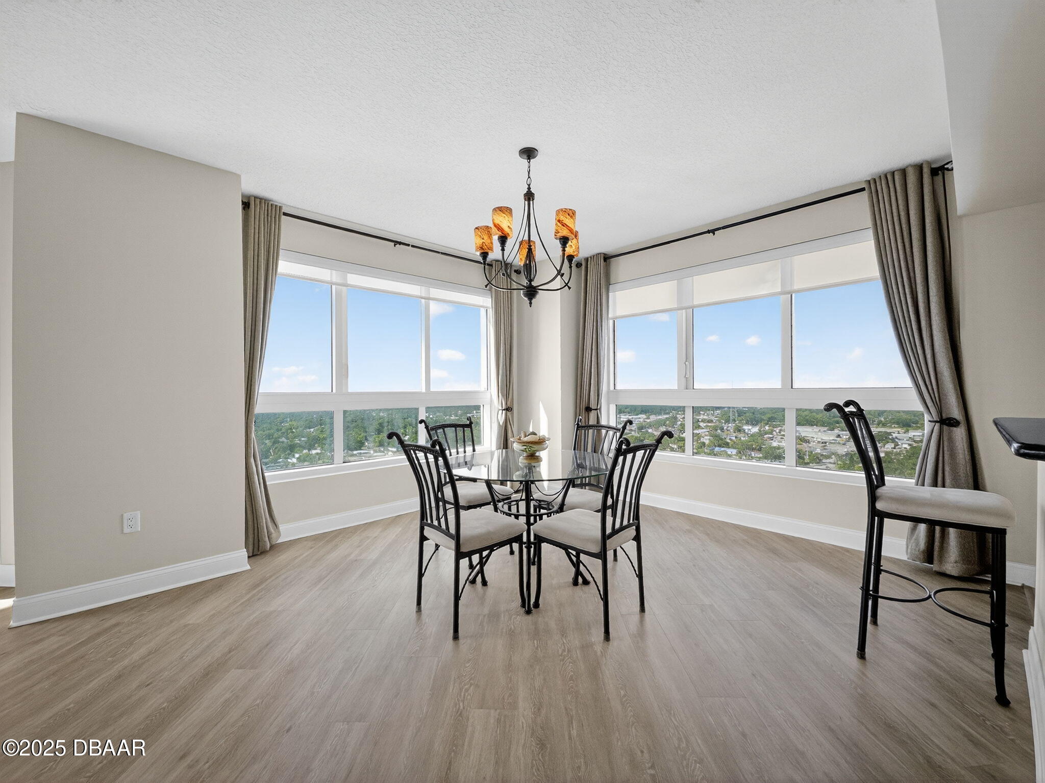 231 Riverside Drive, Unit 2409 Holly Hill, FL 32117 - Photo 7 of 24 a view of a dining room with furniture window and wooden floor