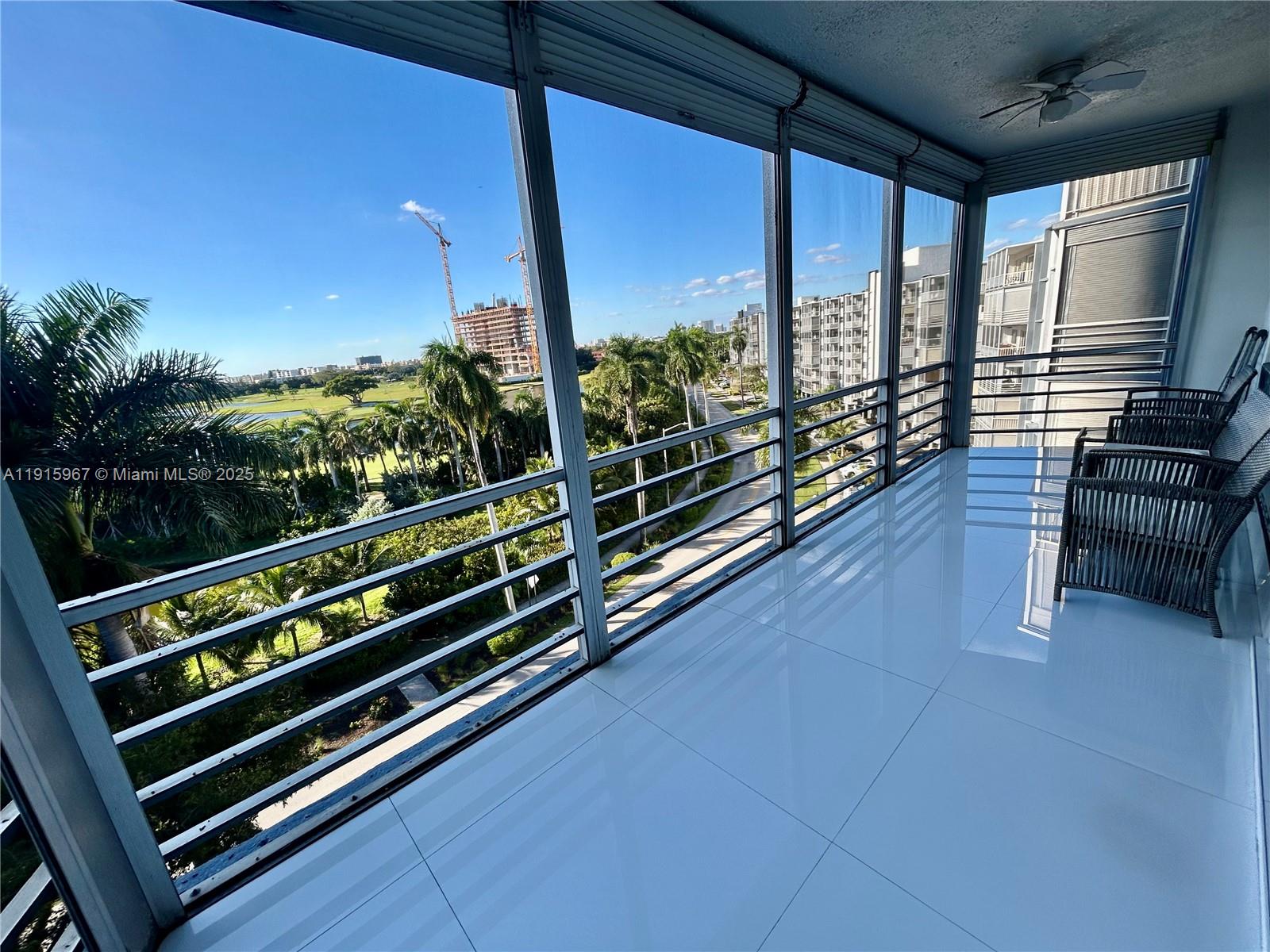 200 Diplomat Parkway, Unit 721 Hallandale Beach, FL 33009 - Photo 22 of 47 a view of a chairs and table in the room