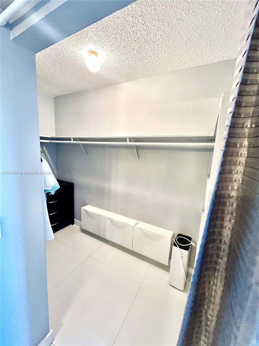 200 Diplomat Parkway, Unit 721 Hallandale Beach, FL 33009 - Photo 25 of 47 a close view of cabinet