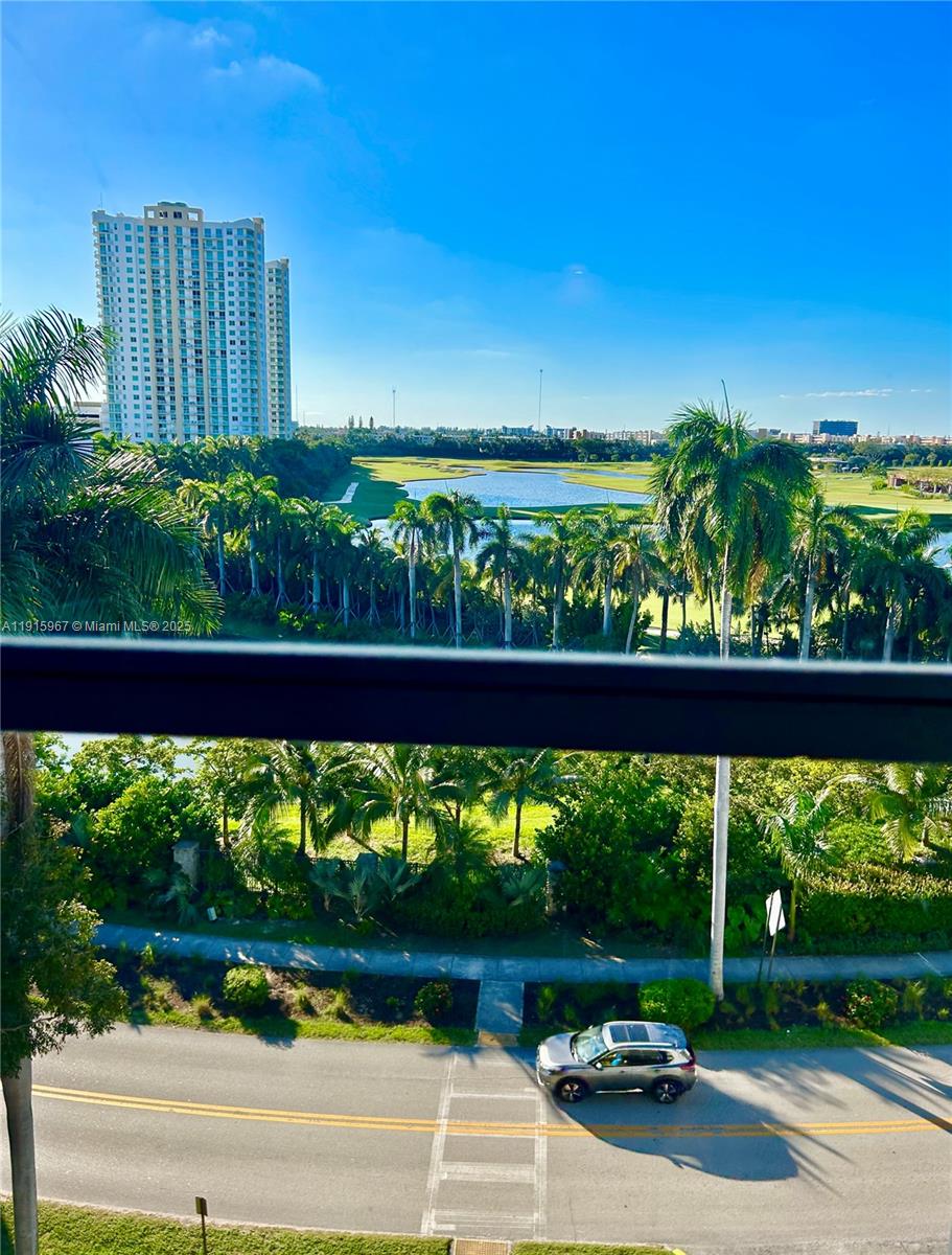 200 Diplomat Parkway, Unit 721 Hallandale Beach, FL 33009 - Photo 28 of 47 a view of a garden area with potted plants
