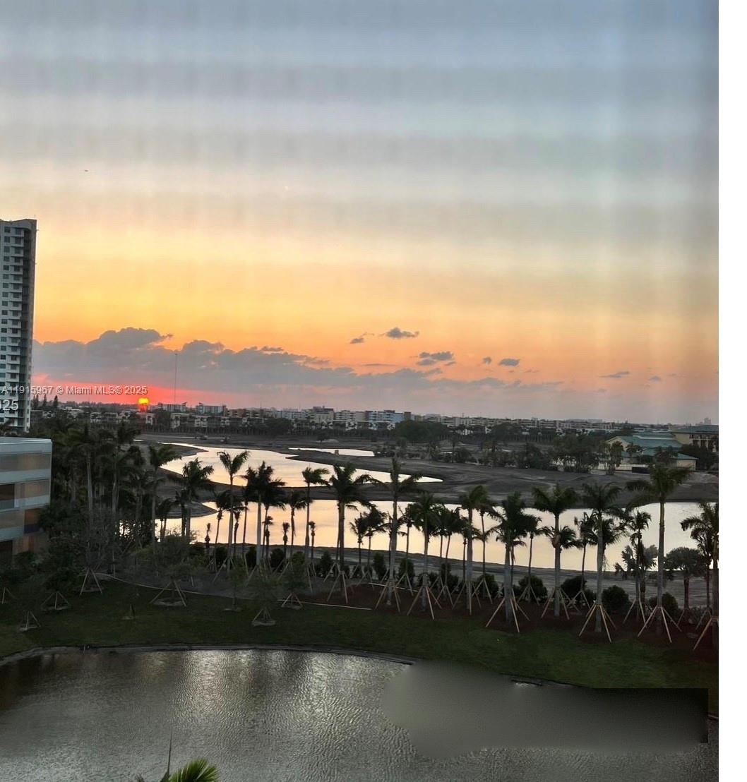 200 Diplomat Parkway, Unit 721 Hallandale Beach, FL 33009 - Photo 30 of 47 a view of a lake with a mountain
