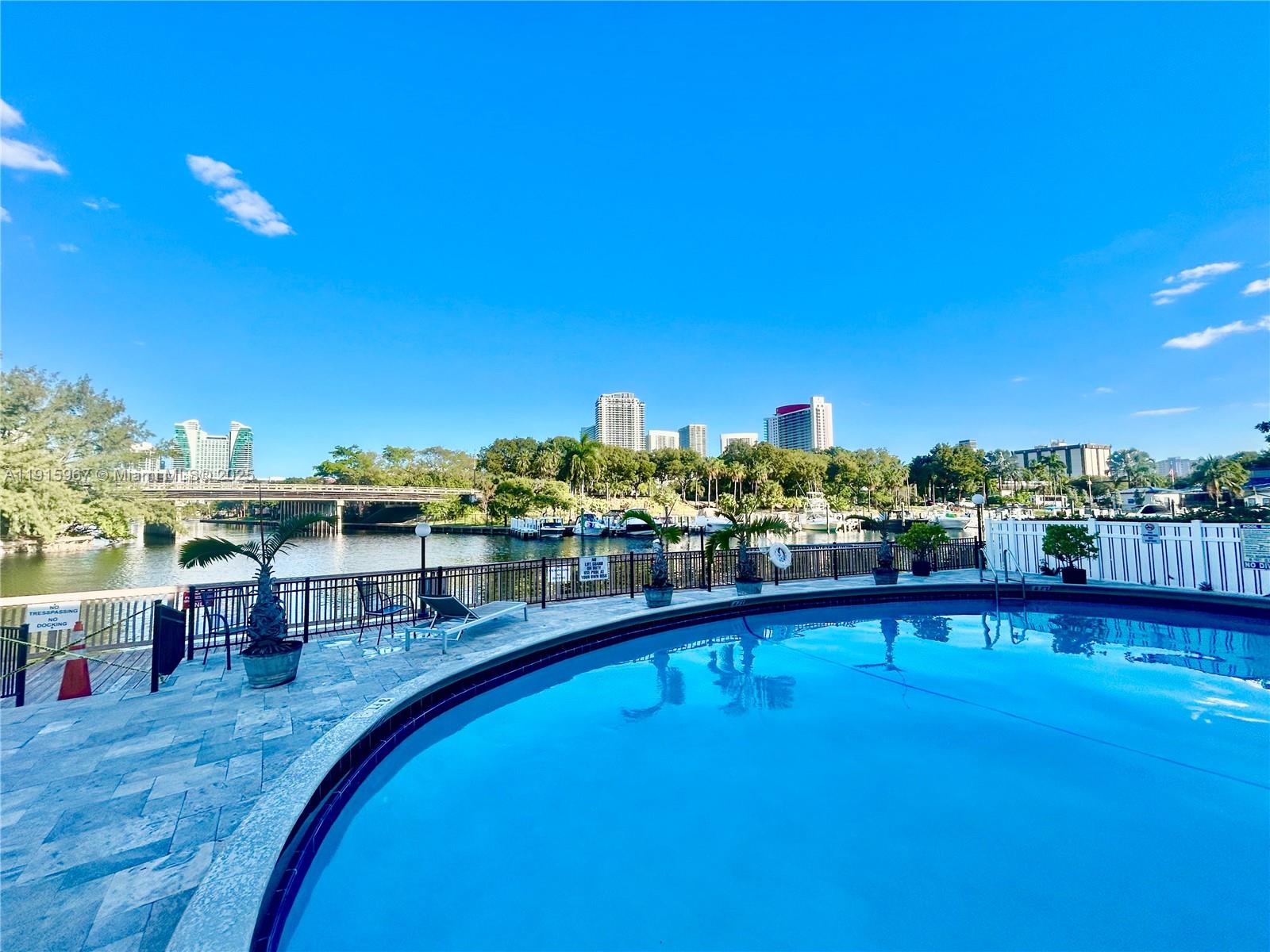 200 Diplomat Parkway, Unit 721 Hallandale Beach, FL 33009 - Photo 38 of 47 a view of a swimming pool with an ocean from a seating space