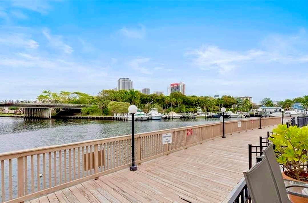 200 Diplomat Parkway, Unit 721 Hallandale Beach, FL 33009 - Photo 46 of 47 a view of a lake with a deck
