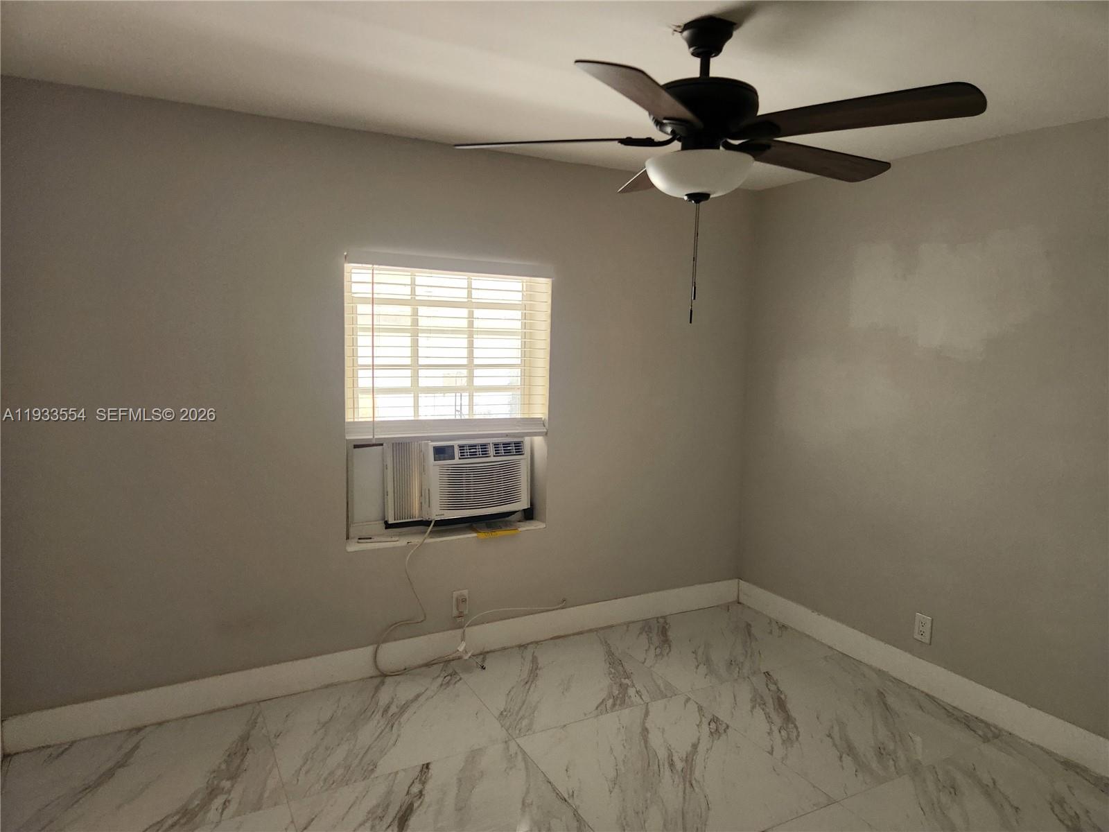 342 East 46th Street, Unit 2 Hialeah, FL 33013 - Photo 12 of 15 a view of a window in an empty room