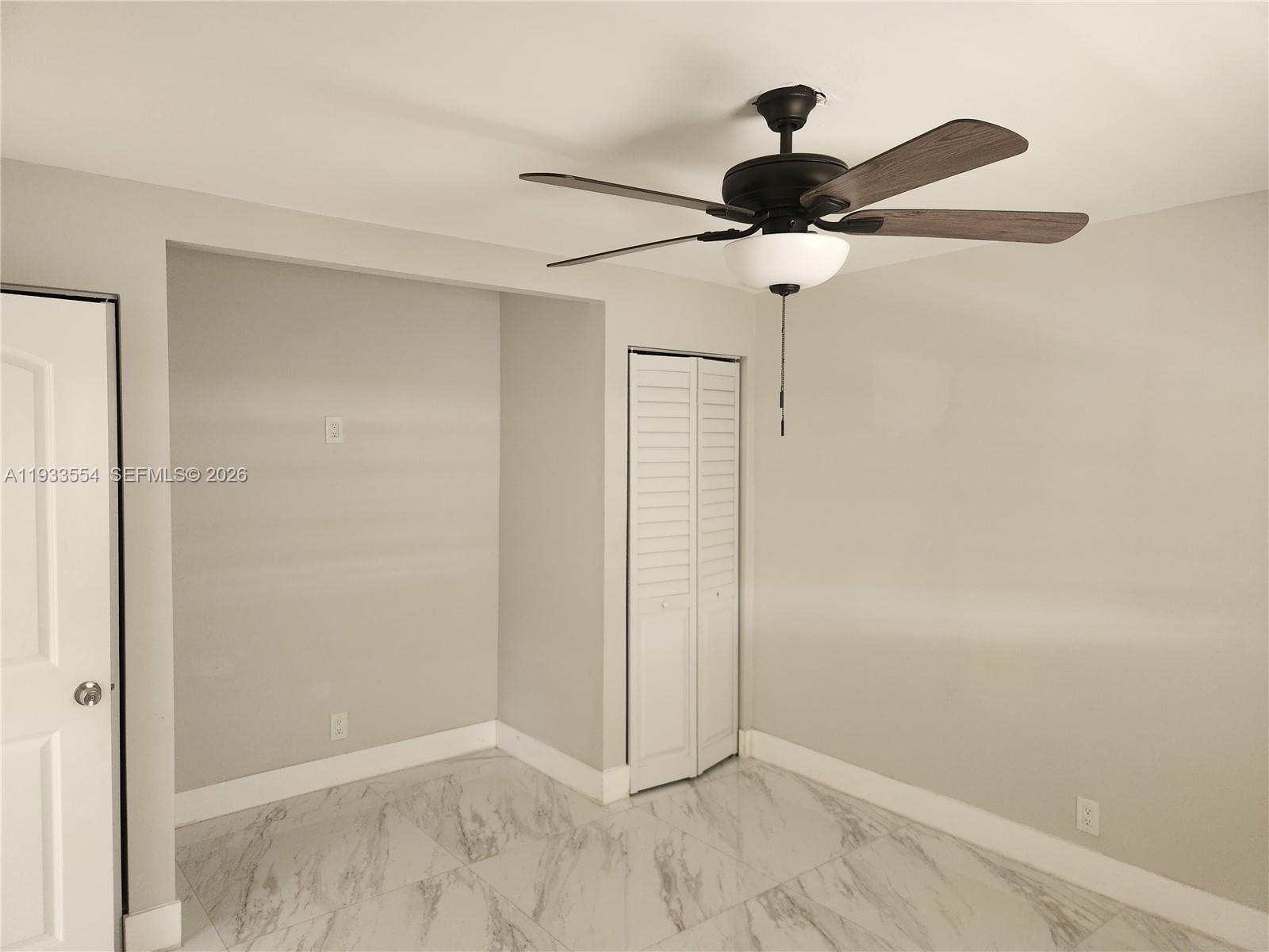 342 East 46th Street, Unit 2 Hialeah, FL 33013 - Photo 8 of 15 a view of a fan in closet