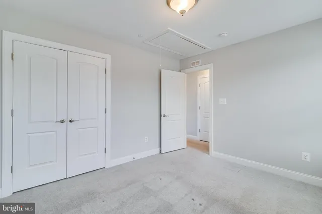 a view of an empty room and a window