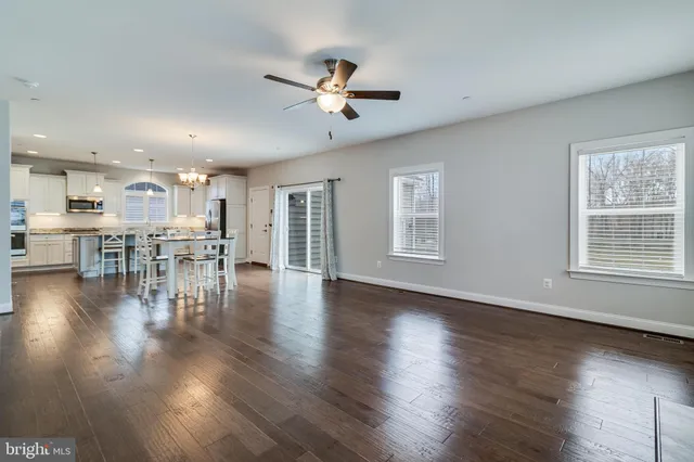 a view of a kitchen with a table and chairs