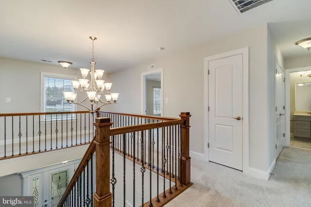 a view of a chandelier in hallway