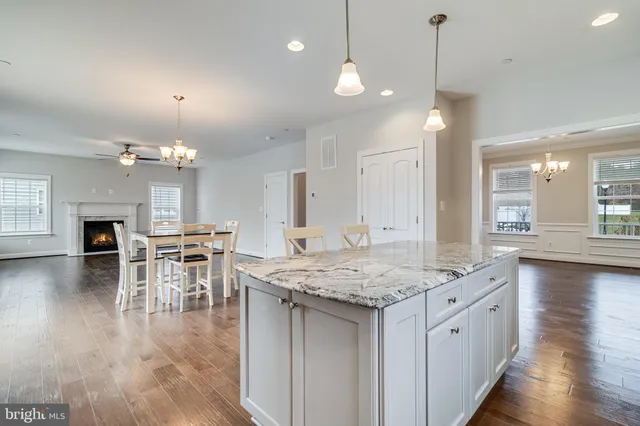 an open kitchen with a table and chairs in it