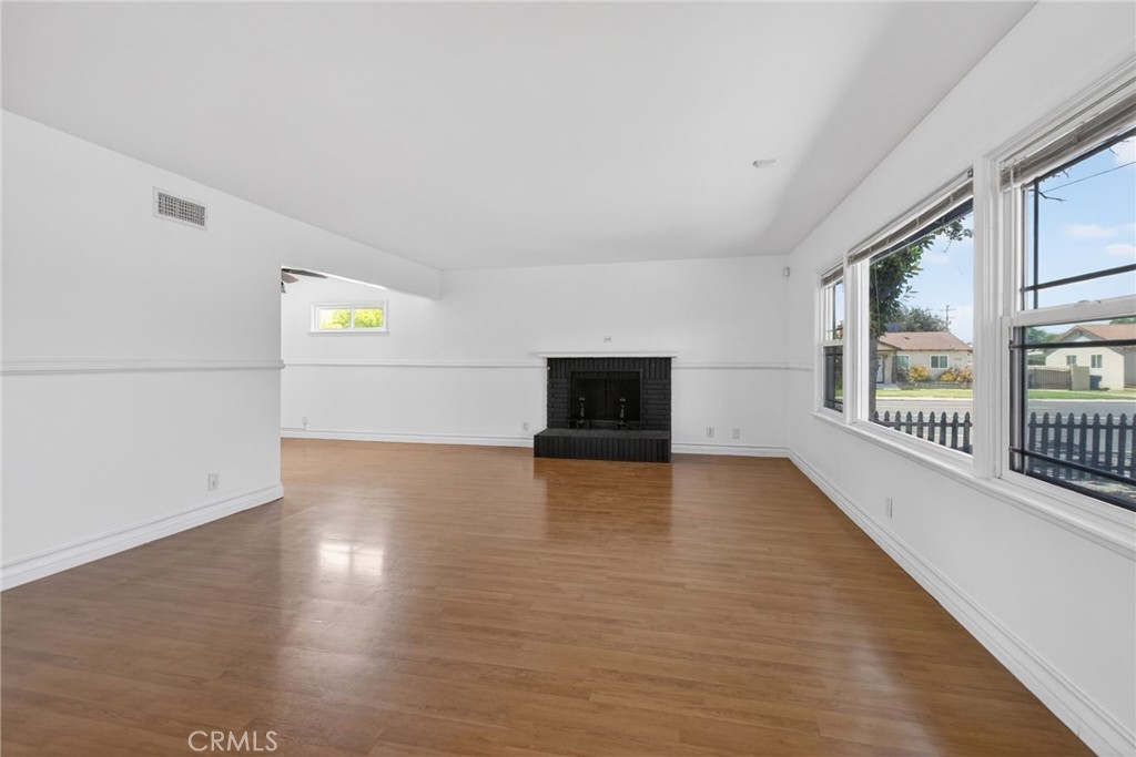 4194 Euclid Court Riverside, CA 92504 - Photo 6 of 29 Spacious living room with double pane windows and fireplace.