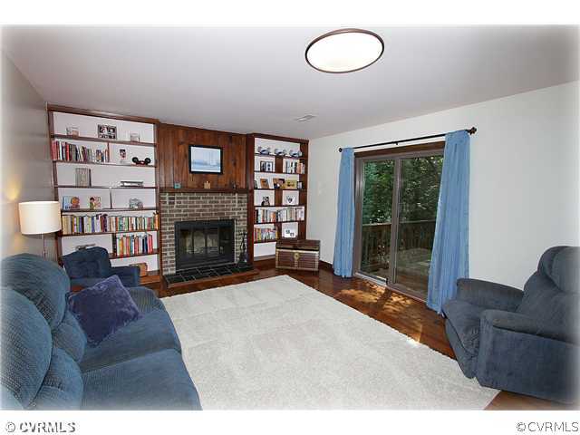 3016 Williamswood Road North Chesterfield, VA 23235 - Photo 6 of 15 a living room with furniture a fireplace and a large window