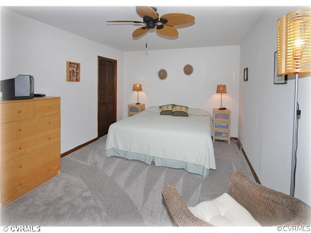 3016 Williamswood Road North Chesterfield, VA 23235 - Photo 8 of 15 a bedroom with a bed and a window