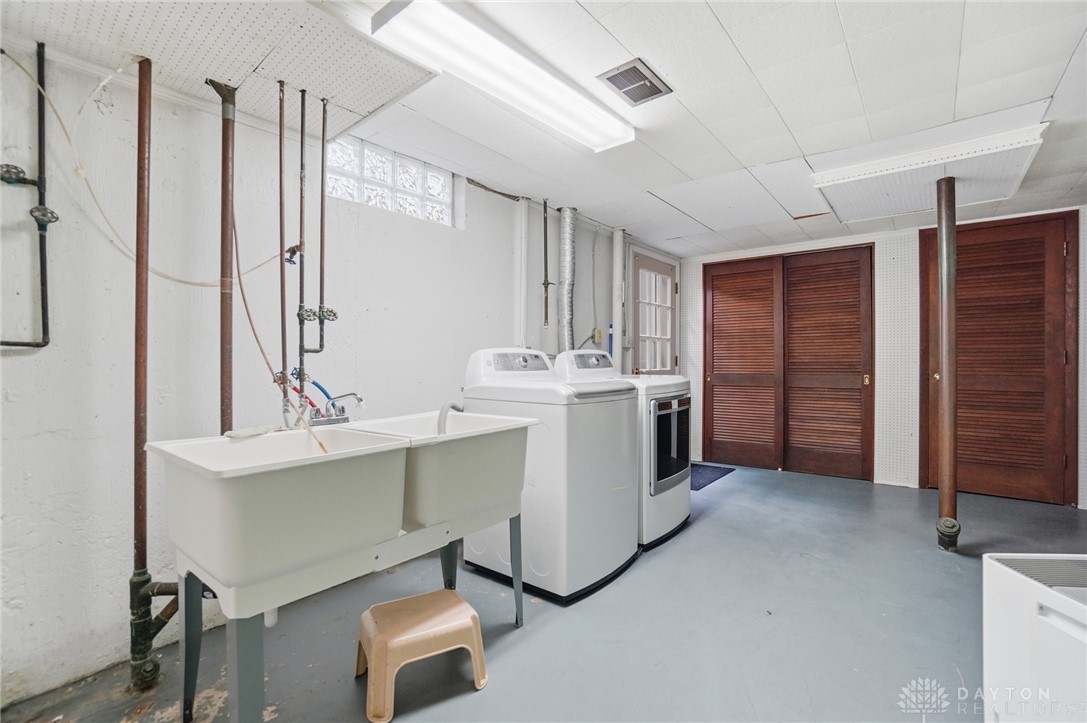 6119 Flemington Road Dayton, OH 45459 - Photo 56 of 76 This functional laundry room features convenient appliances and practical amenities for everyday living.