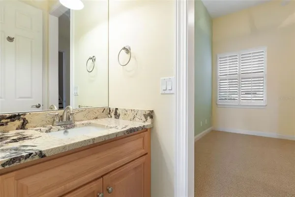 a kitchen with stainless steel appliances granite countertop a refrigerator a sink and a stove