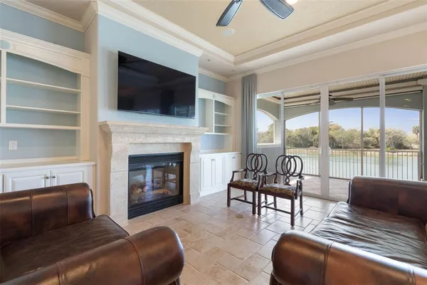 a view of a chandelier in big room and a chandelier