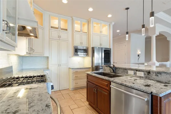 an aerial view of house with yard and lake view