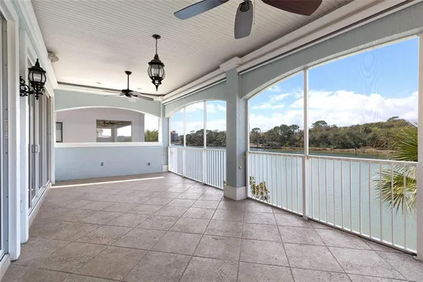 an aerial view of residential houses with outdoor space and lake view
