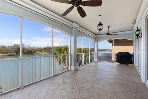 an aerial view of residential houses with outdoor space and river