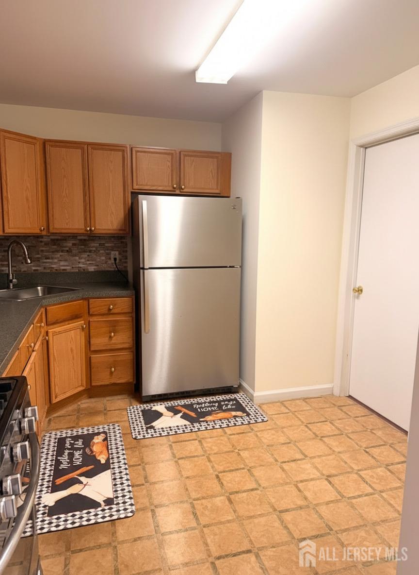 413 College Drive Edison, NJ 08817 - Photo 12 of 20 a view of a kitchen with a sink