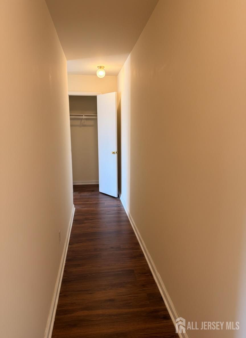413 College Drive Edison, NJ 08817 - Photo 13 of 20 a view of a hallway with wooden floor