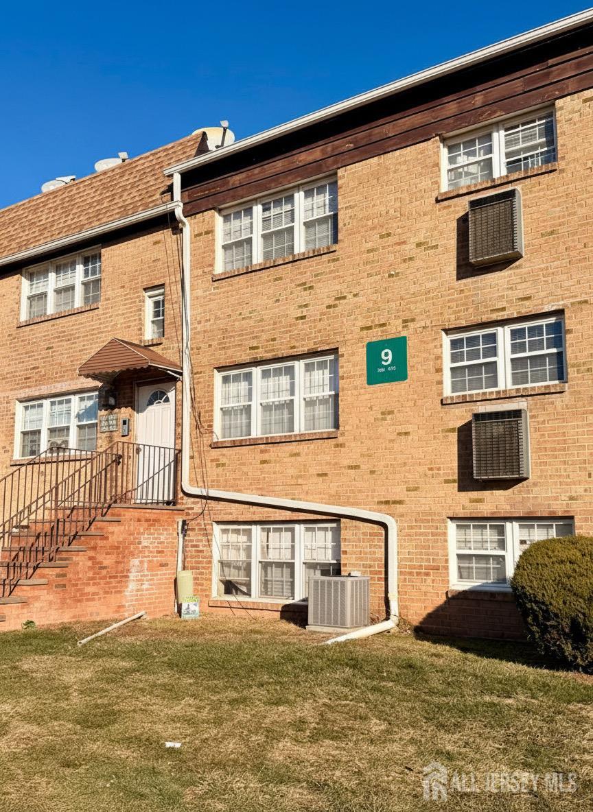 413 College Drive Edison, NJ 08817 - Photo 2 of 20 a front view of a house with a yard