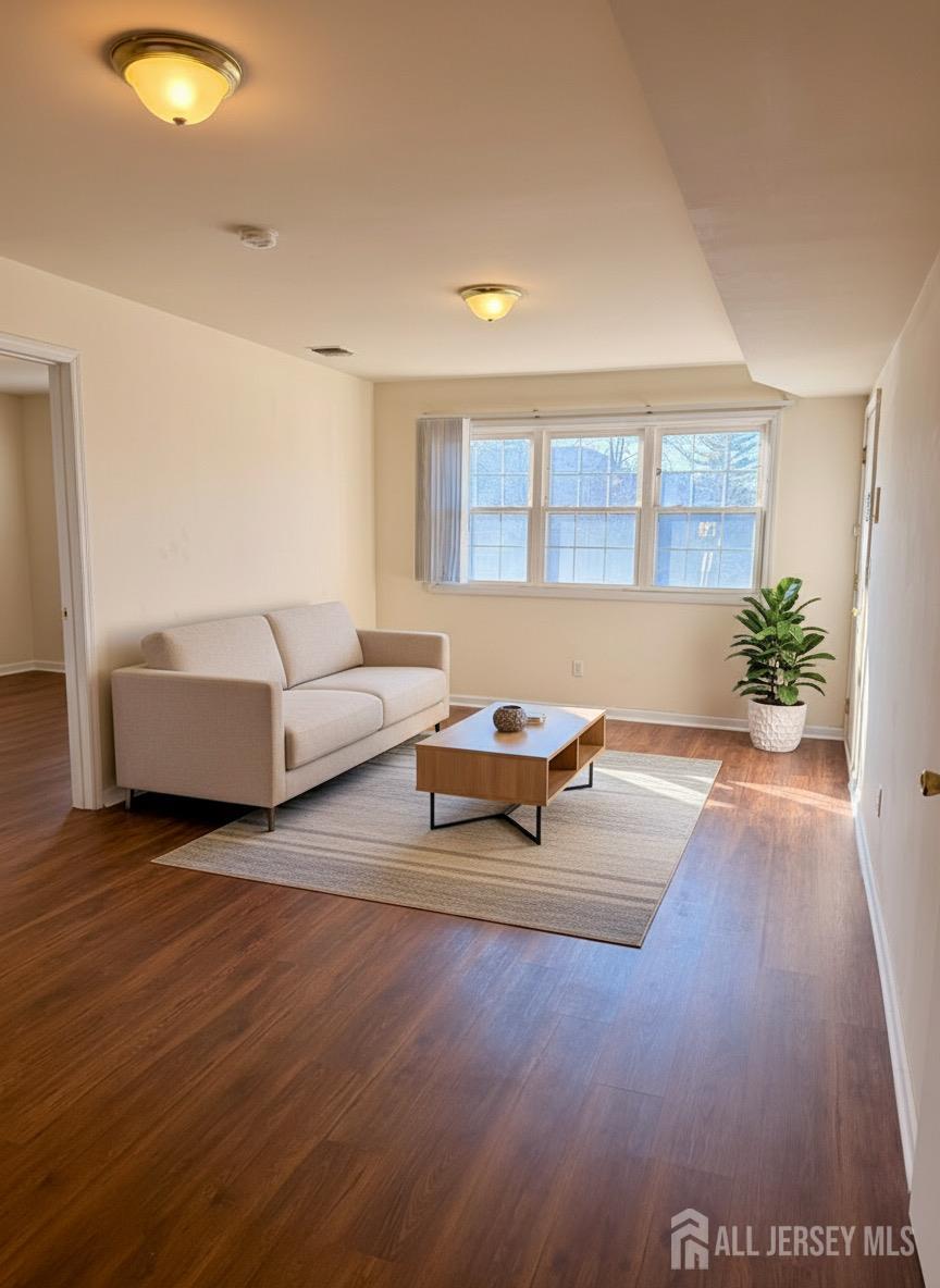 413 College Drive Edison, NJ 08817 - Photo 5 of 20 a living room with furniture and a potted plant