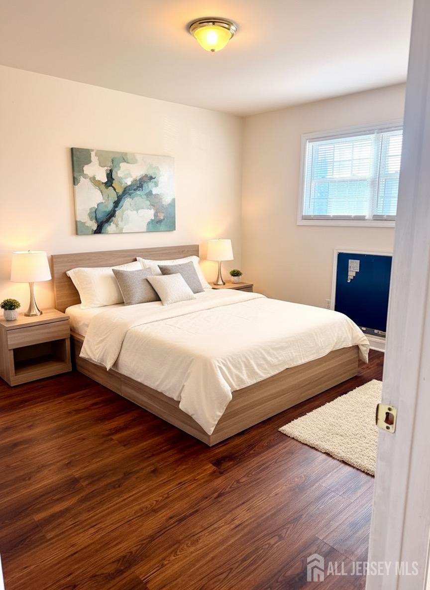 413 College Drive Edison, NJ 08817 - Photo 8 of 20 a bedroom with double bed and a window