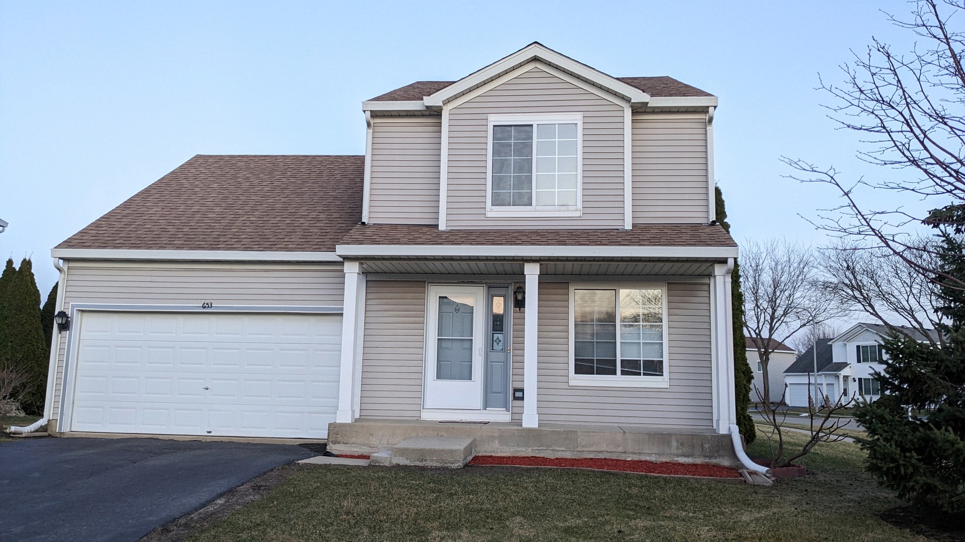 653 Fairview Lane South Elgin, IL 60177 - Photo 1 of 25 a front view of a house with a yard