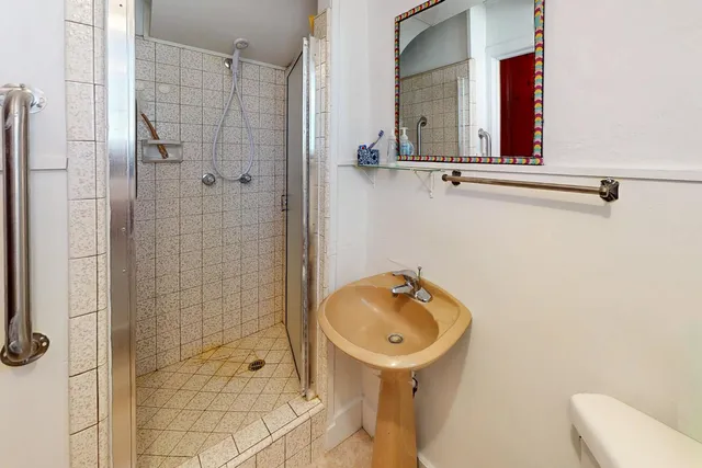a bathroom with a sink and mirror