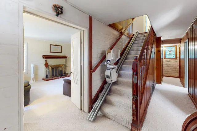 a view of a hallway with staircase