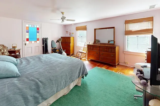 a bed room with a bed and a window