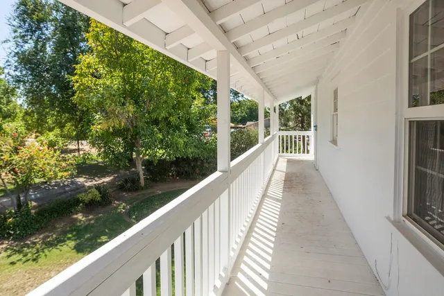 a view of balcony and yard
