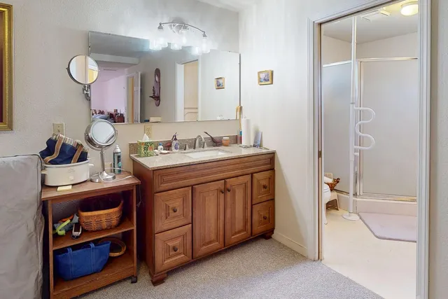 a bathroom with a sink a vanity and a mirror