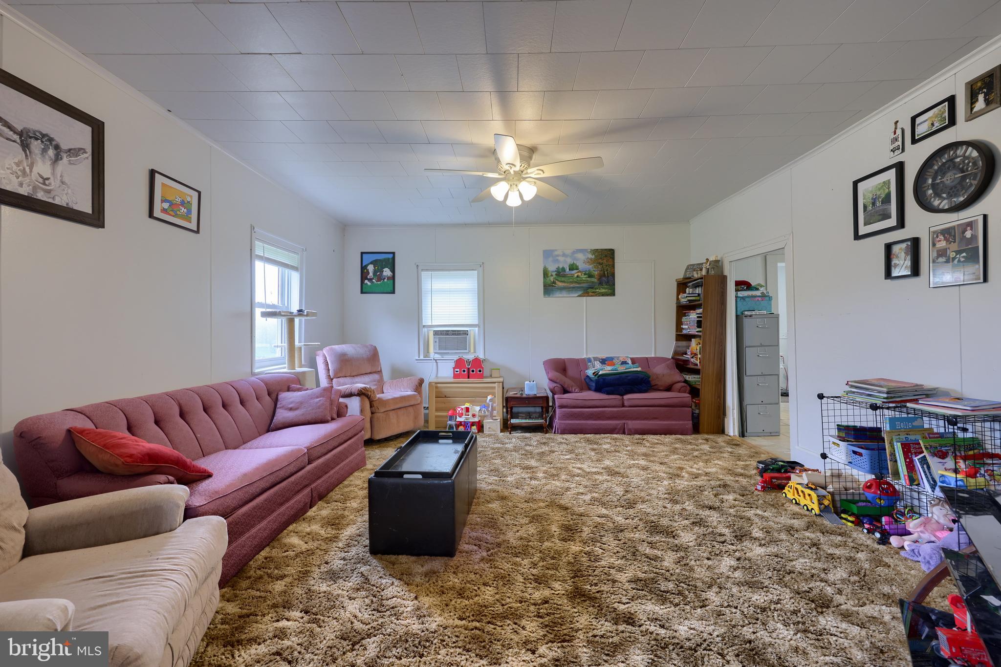 15 Snyder Road Pitman, PA 17964 - Photo 109 of 120 a living room with furniture a rug and a window
