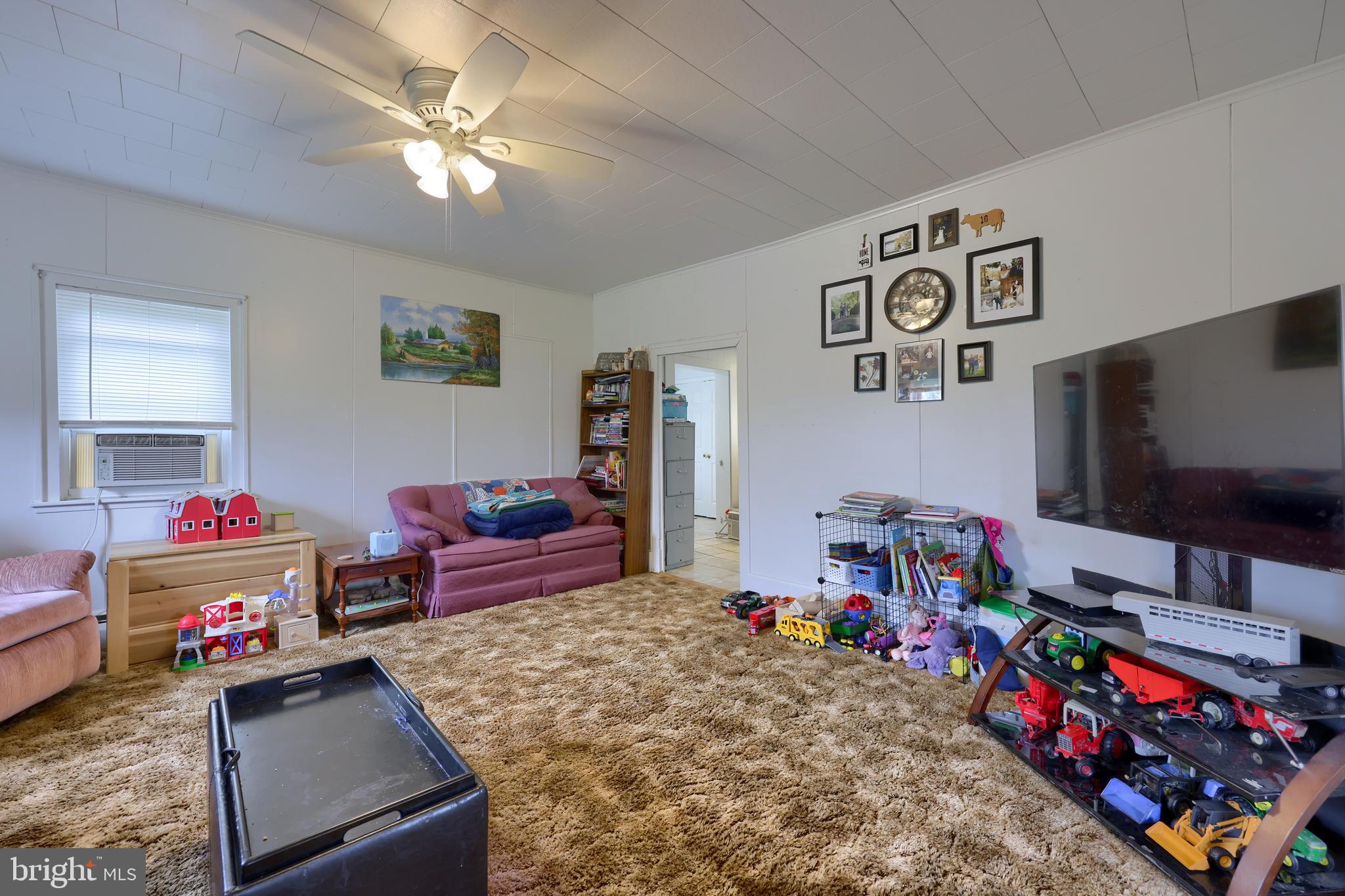 15 Snyder Road Pitman, PA 17964 - Photo 110 of 120 a living room with furniture and a flat screen tv