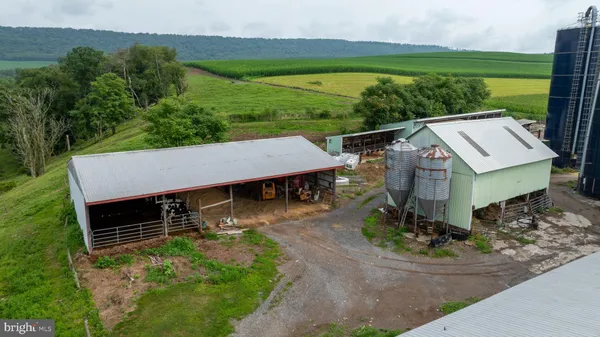 an aerial view of a house with outdoor space tennis court