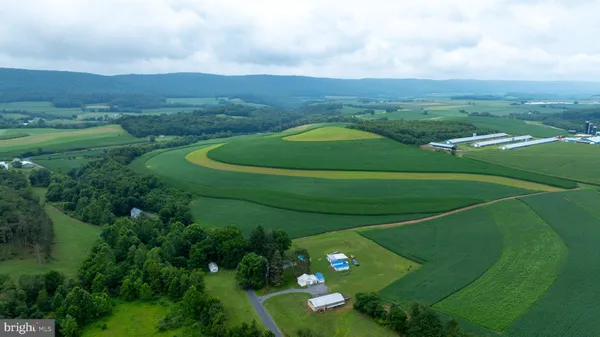 a kitchen with a table chairs and a refrigerator