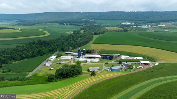 a kitchen with stainless steel appliances granite countertop a stove sink and cabinets
