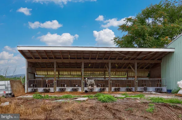 a kitchen that has a lot of cabinets and refrigerator in it