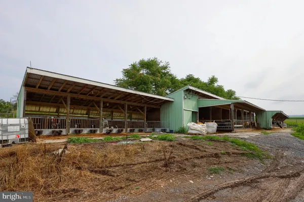 a view of a dining room with furniture and a chandelier