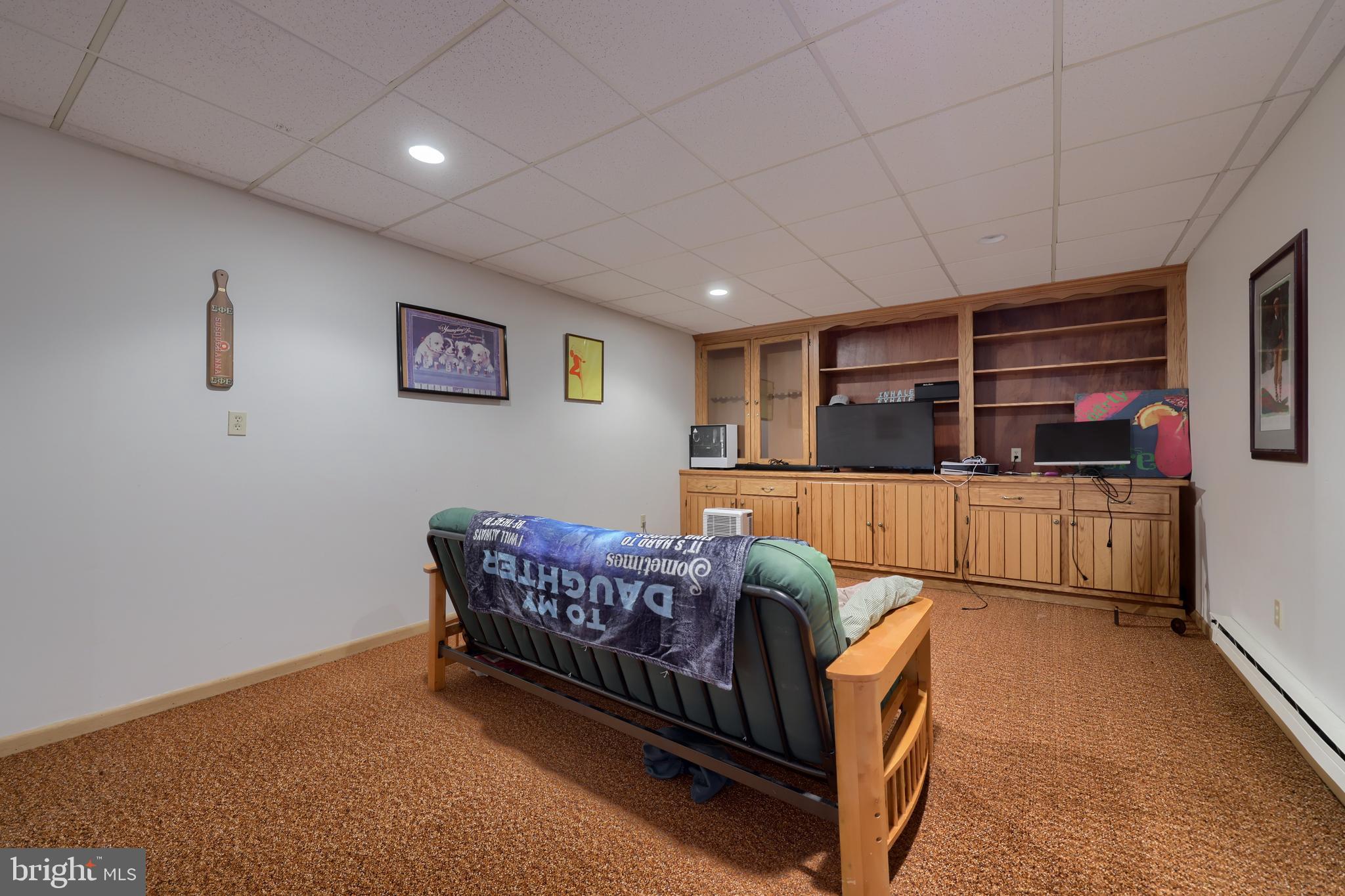 15 Snyder Road Pitman, PA 17964 - Photo 68 of 120 a living room with furniture a flat screen tv and a table