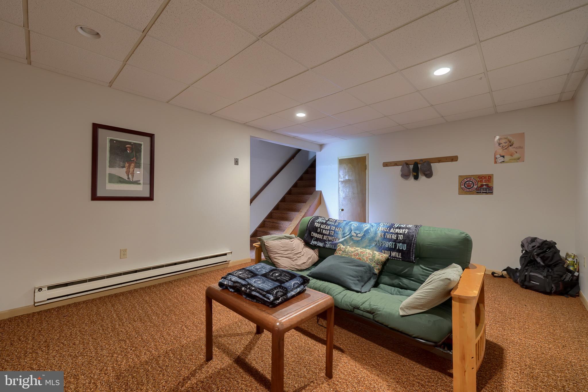 15 Snyder Road Pitman, PA 17964 - Photo 70 of 120 a living room with furniture and a wooden floor