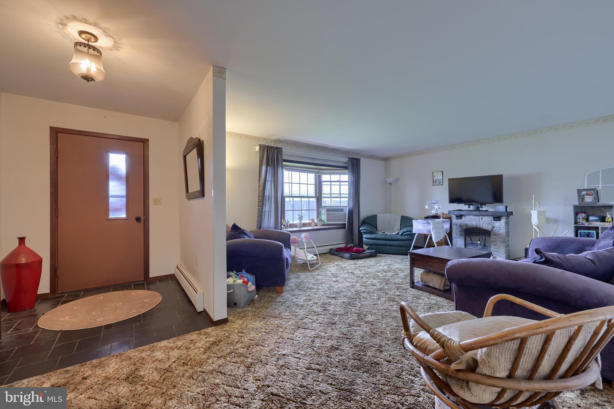15 Snyder Road Pitman, PA 17964 - Photo 73 of 120 a living room with furniture a ceiling fan and a window